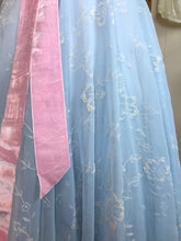 A close up showing the velvety texture of the flocked organza on a fifties ball gown / prom dress 