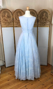 back view of a floor length 1950's pale blue ballgown with a soft, full skirt 