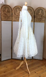 The side view of a 50's prom dress style wedding dress