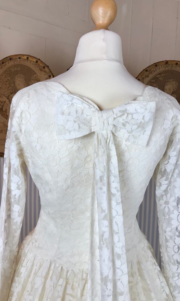 Long sleeved 50 s dress with circle skirt and bow back detail