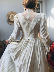 Back view - Edwardian replica wedding gown with a high neck and deep lace V in the back. The dress has a tiny waist and is reminiscent of Princess Diana's wedding dress with it's dreamy romantic feel