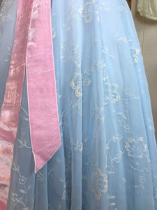 A close up showing the velvety texture of the flocked organza on a fifties ball gown / prom dress 