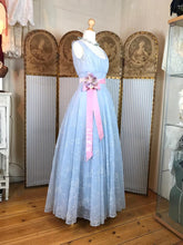 Beautiful pale blue 50's dress with a pink satin sash and waist corsage 