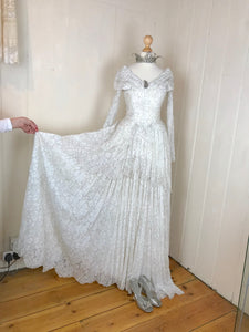 A generous amount of fabric makes up the skirt of this stunning vintage lace ball gown / wedding dress