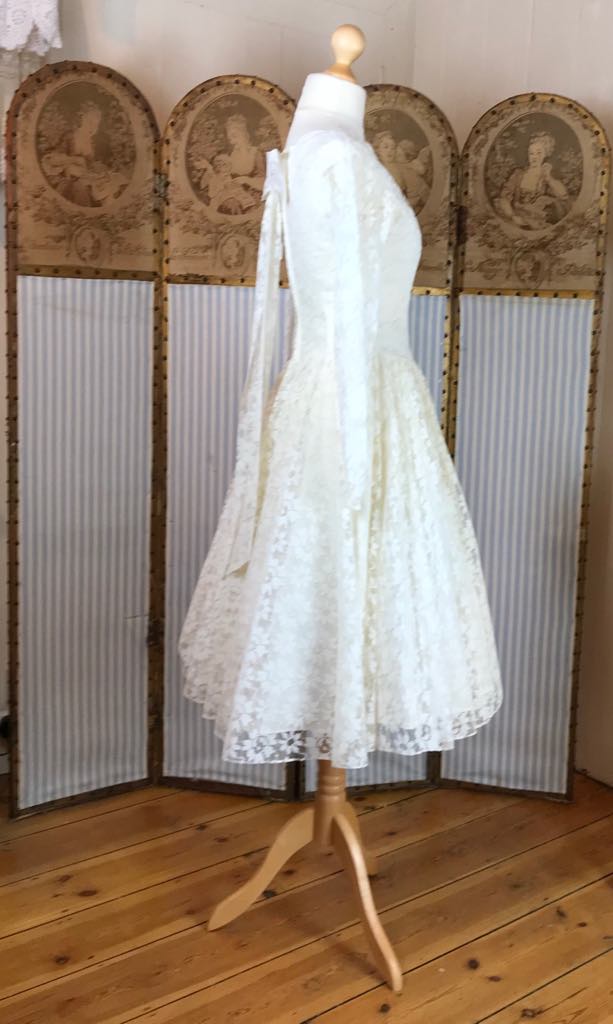 Long sleeved 50's dress with circle skirt and bow back detail. Size uk Days of Grace Vintage Long sleeved 50's dress with circle skirt and bow back detail. Size uk Days of Grace Vintage