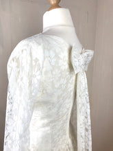 Side back angle of a beautiful lace bow on an original 50's wedding dress