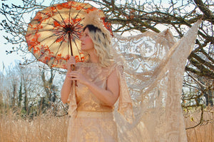 Bohemian bridal inspiration - beautiful gold lace grecian vintage dress worn with a feather style pampus grass vintage headpiece and a pretty antique parasol
