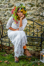 Gorgeous and unique autumn bridal look  - an Edwardian lace gown is teamed with a vibrant, oversized flower crown and brown leather boots
